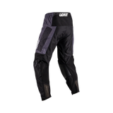 Black motocross pants with gray accents on a white background